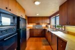 Kitchen located off the dining area offers everything you need to cook your favorite meals